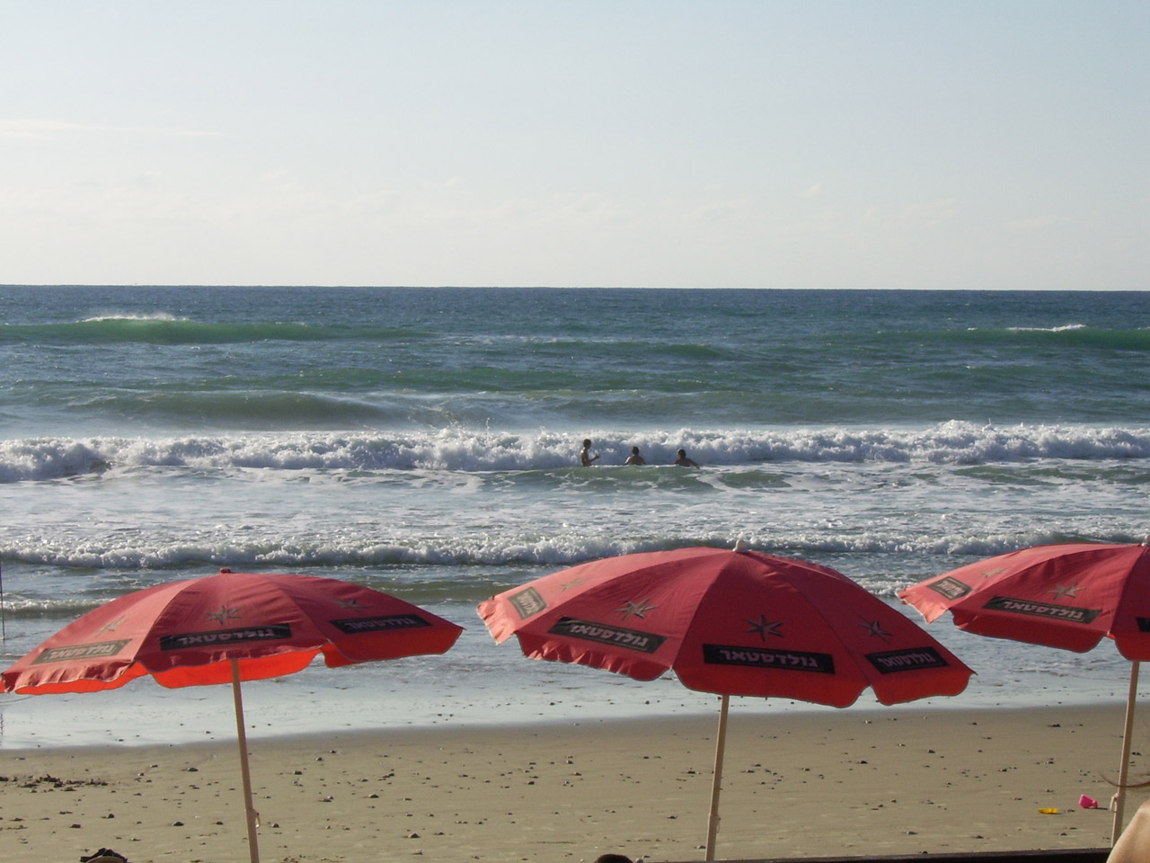 red umbrellas beach free photo