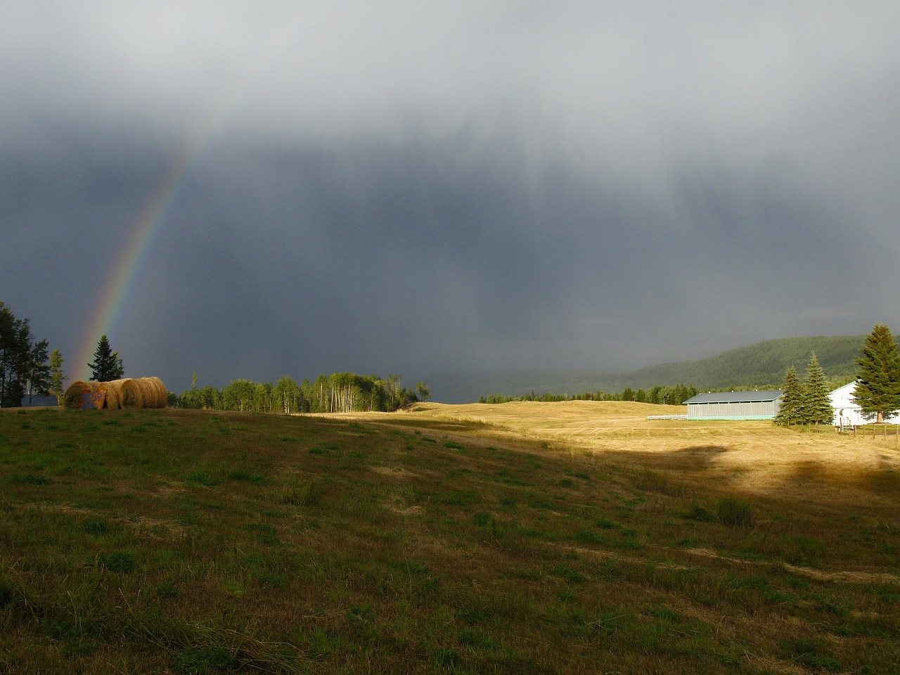 thunderstorm dark sky rainbow free photo