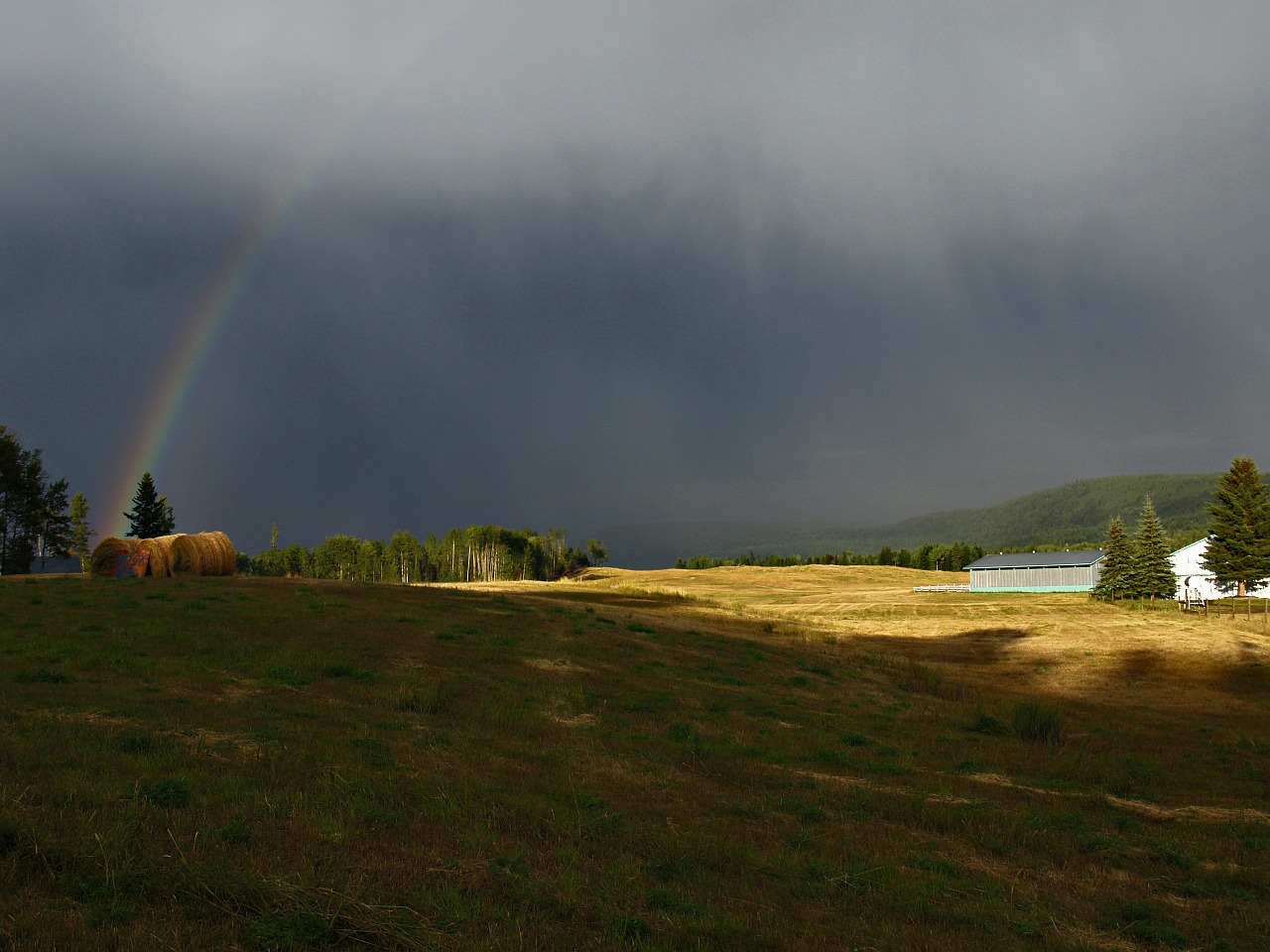 thunderstorm rainbow field free photo
