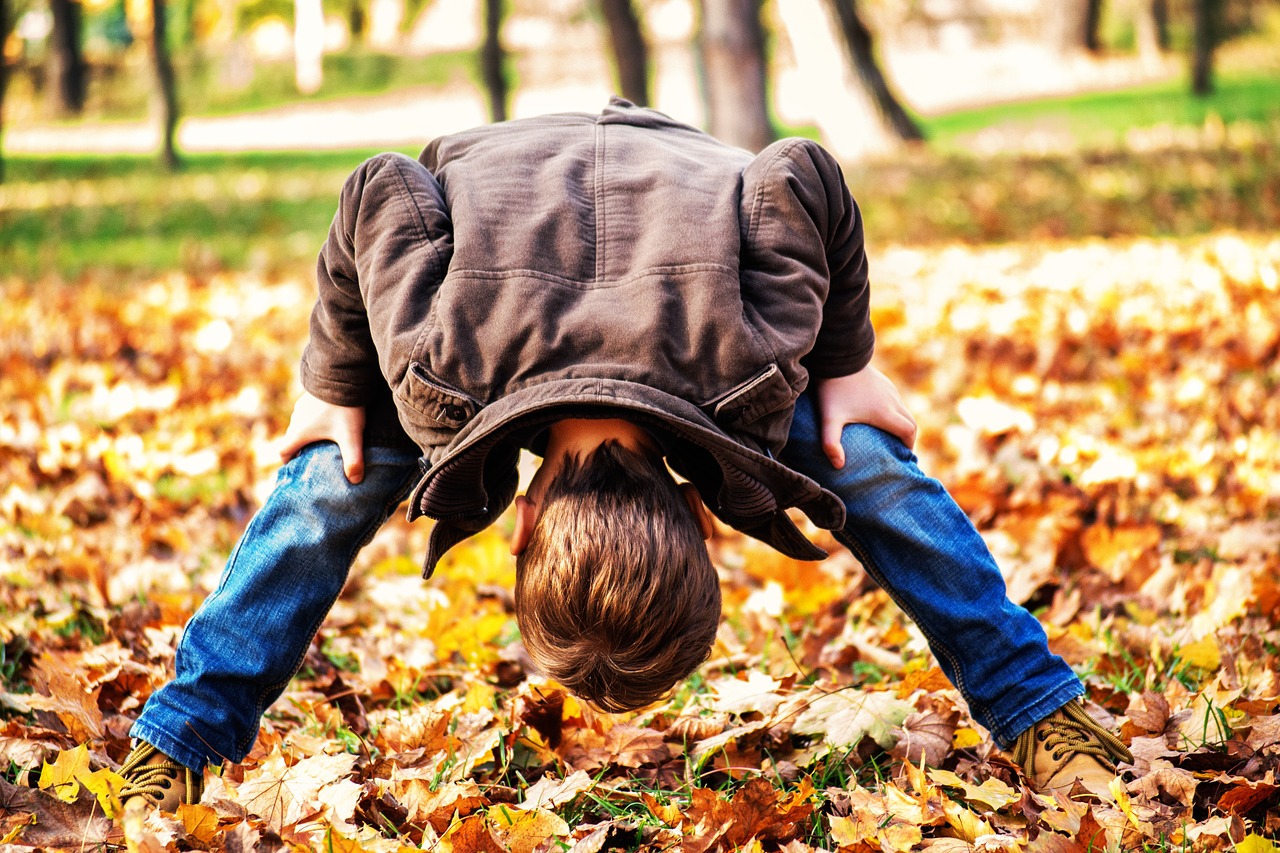 toddler child looking through legs free photo