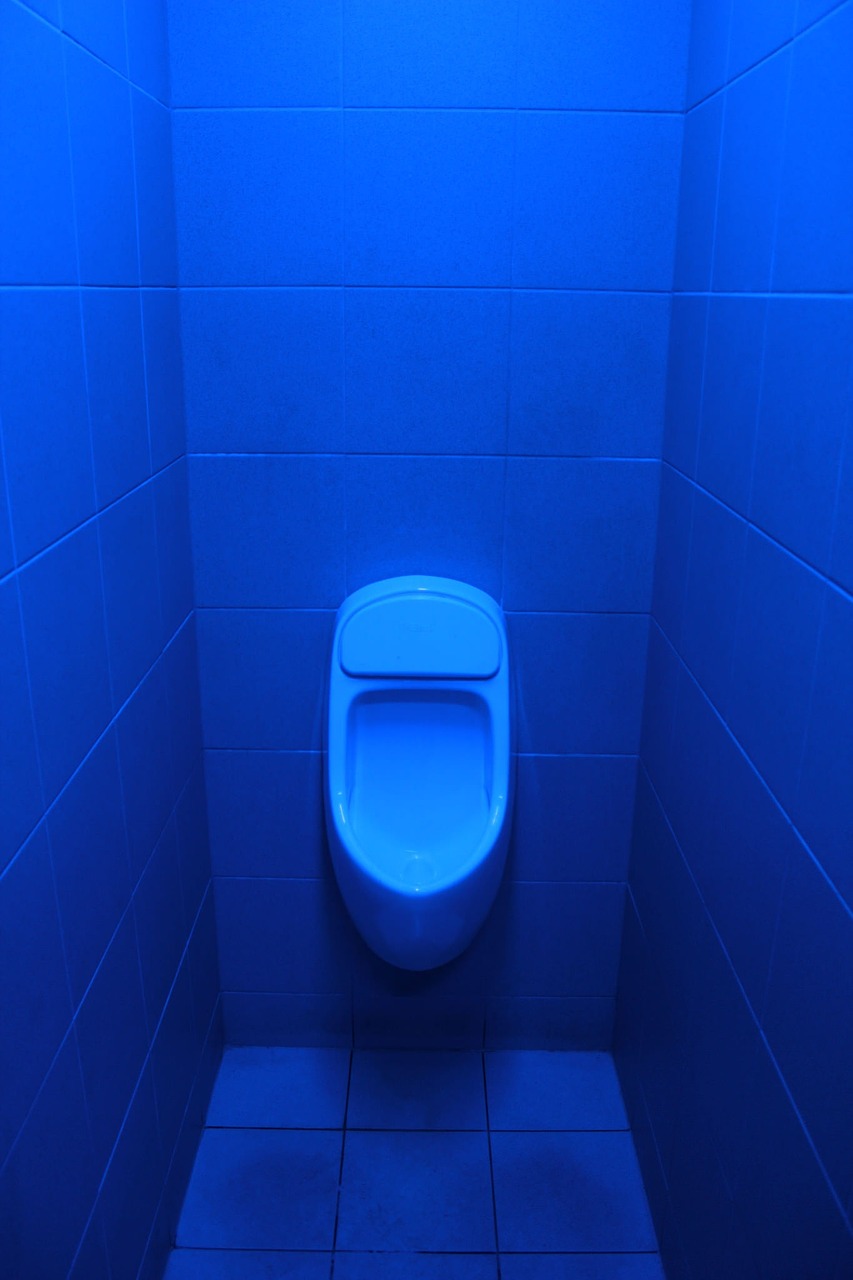 toilet for men blue oil background free photo