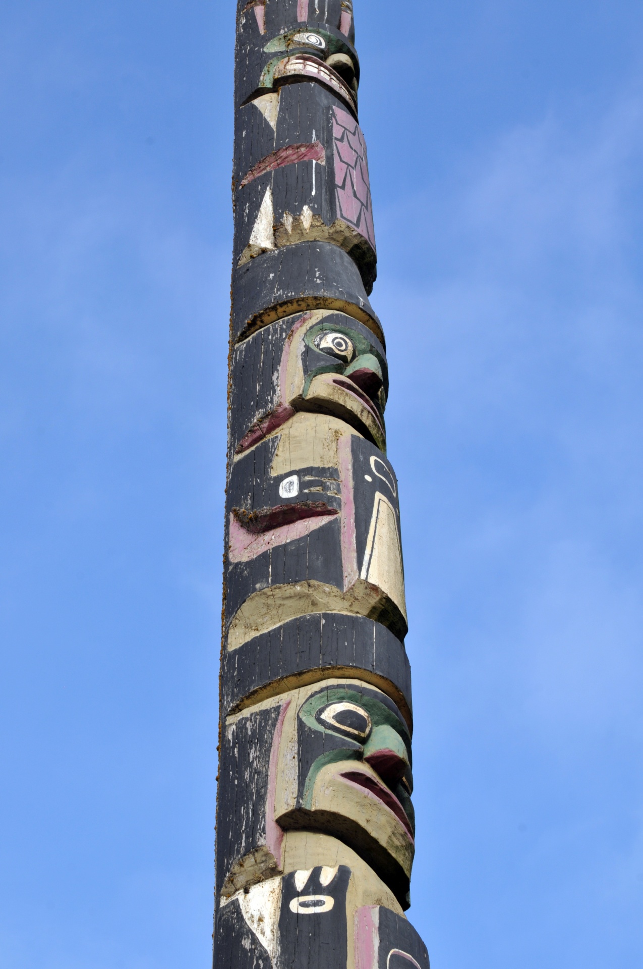 totem pole faces wood free photo