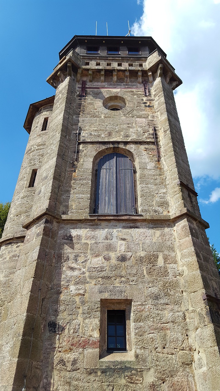 tower  granite stone  sky free photo