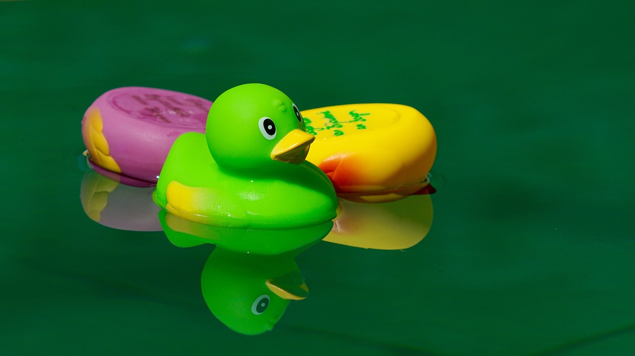 toys squeak duck in the water free photo