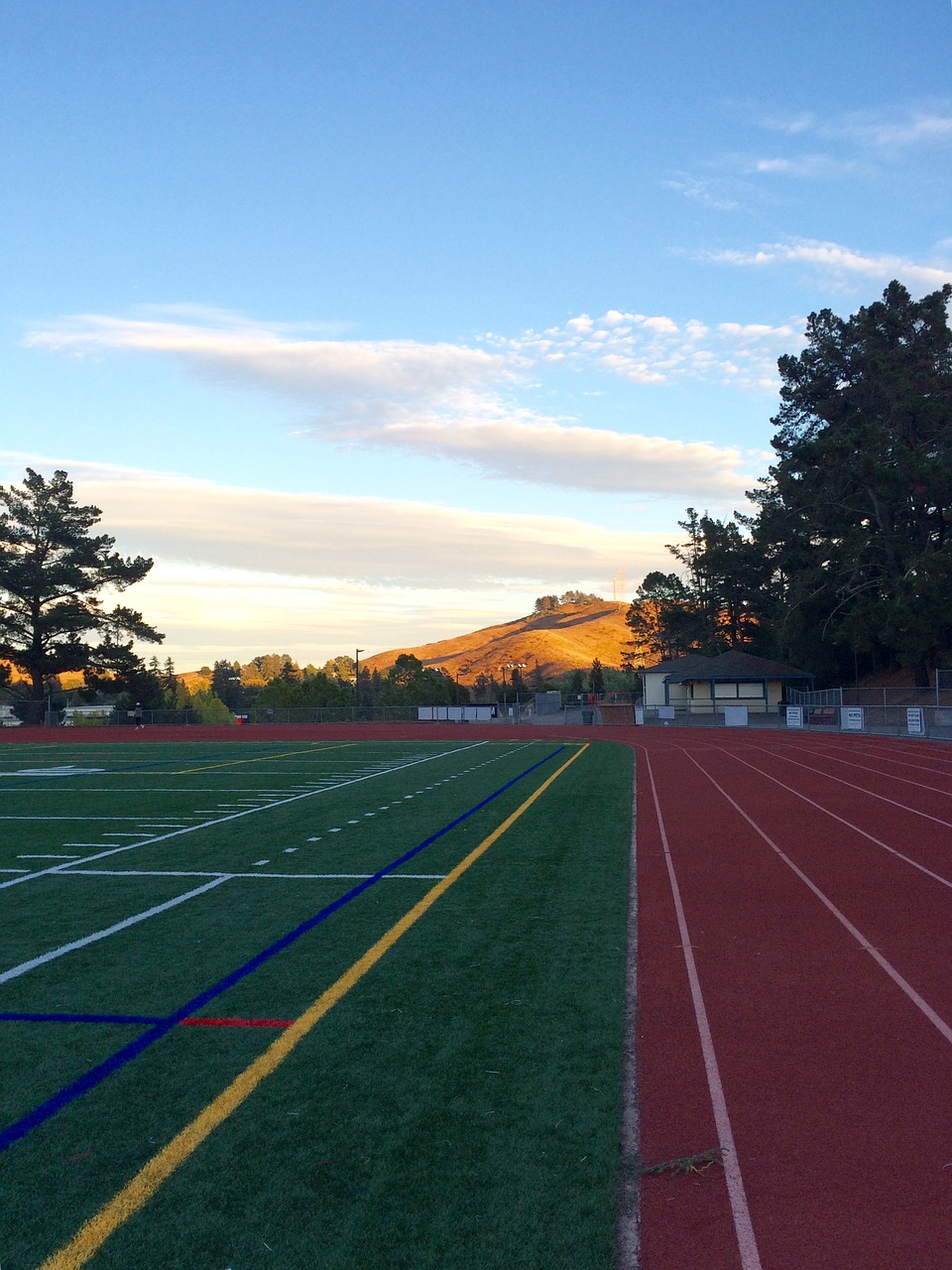 track and field sunset athletic field free photo