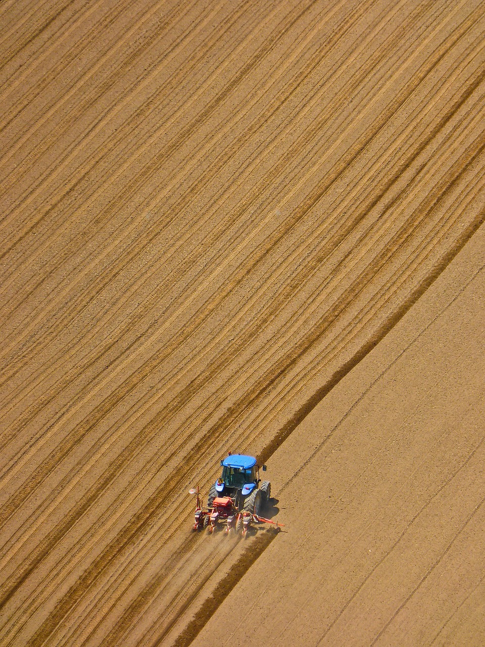 tractor ploughing field free photo
