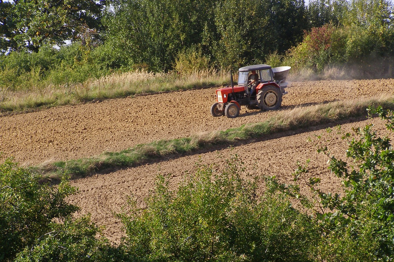 tractor agricultural machine working on the field free photo