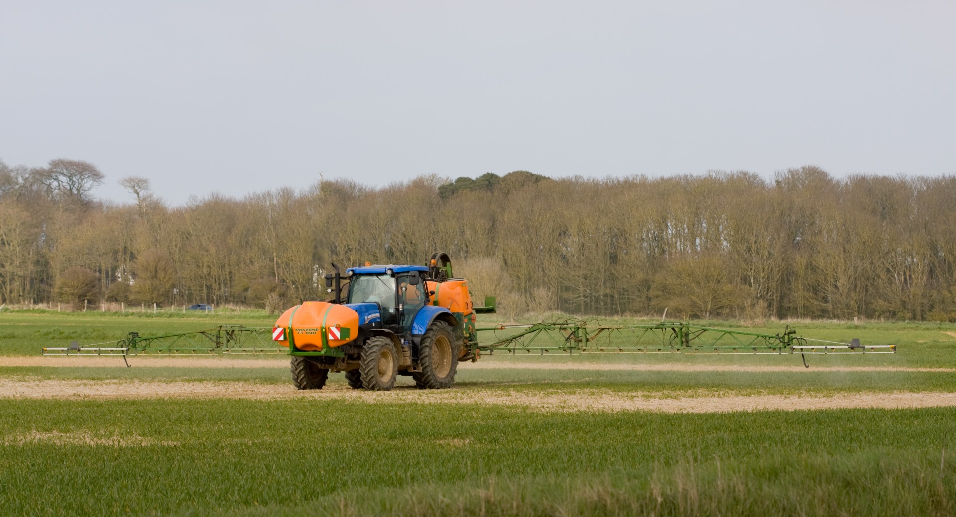 tractor spraying crop spraying free photo
