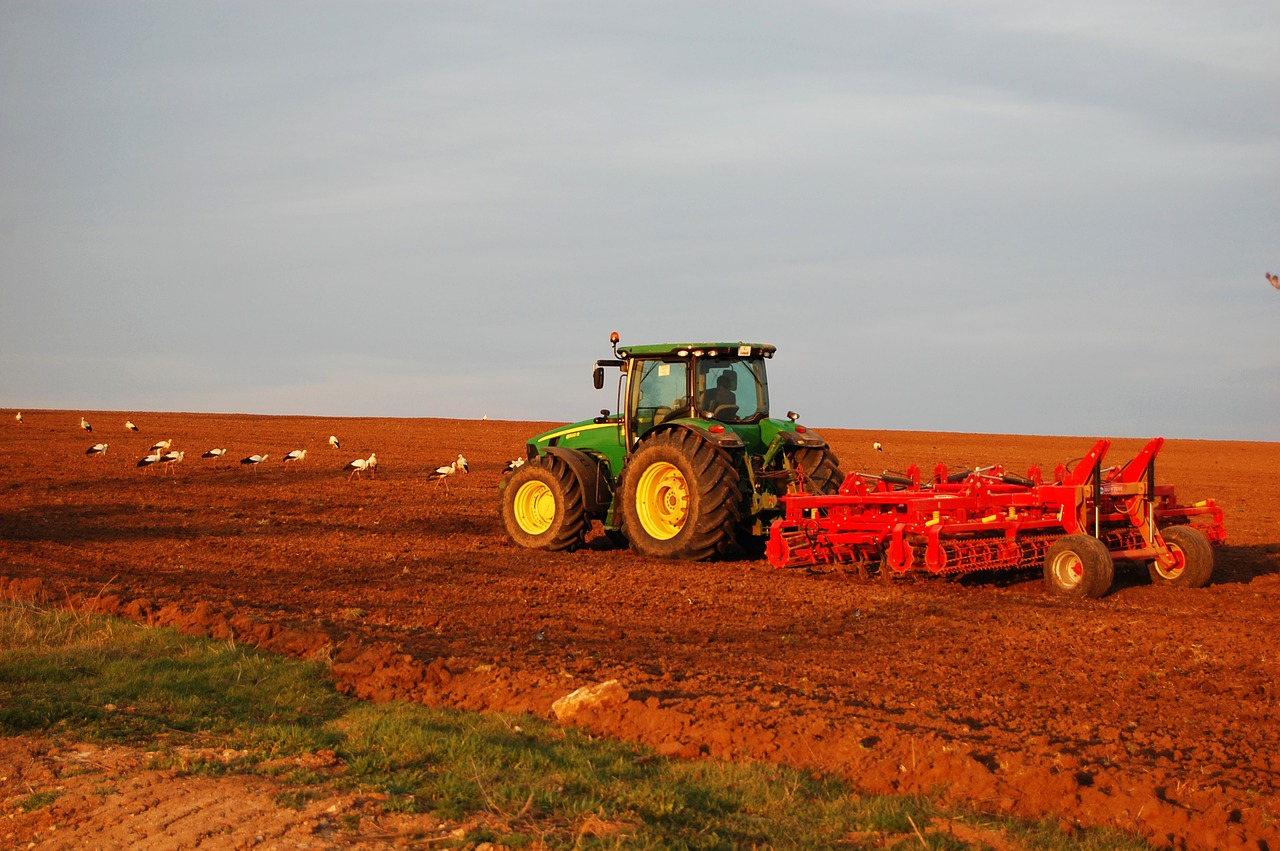 tractor  plowing  field free photo