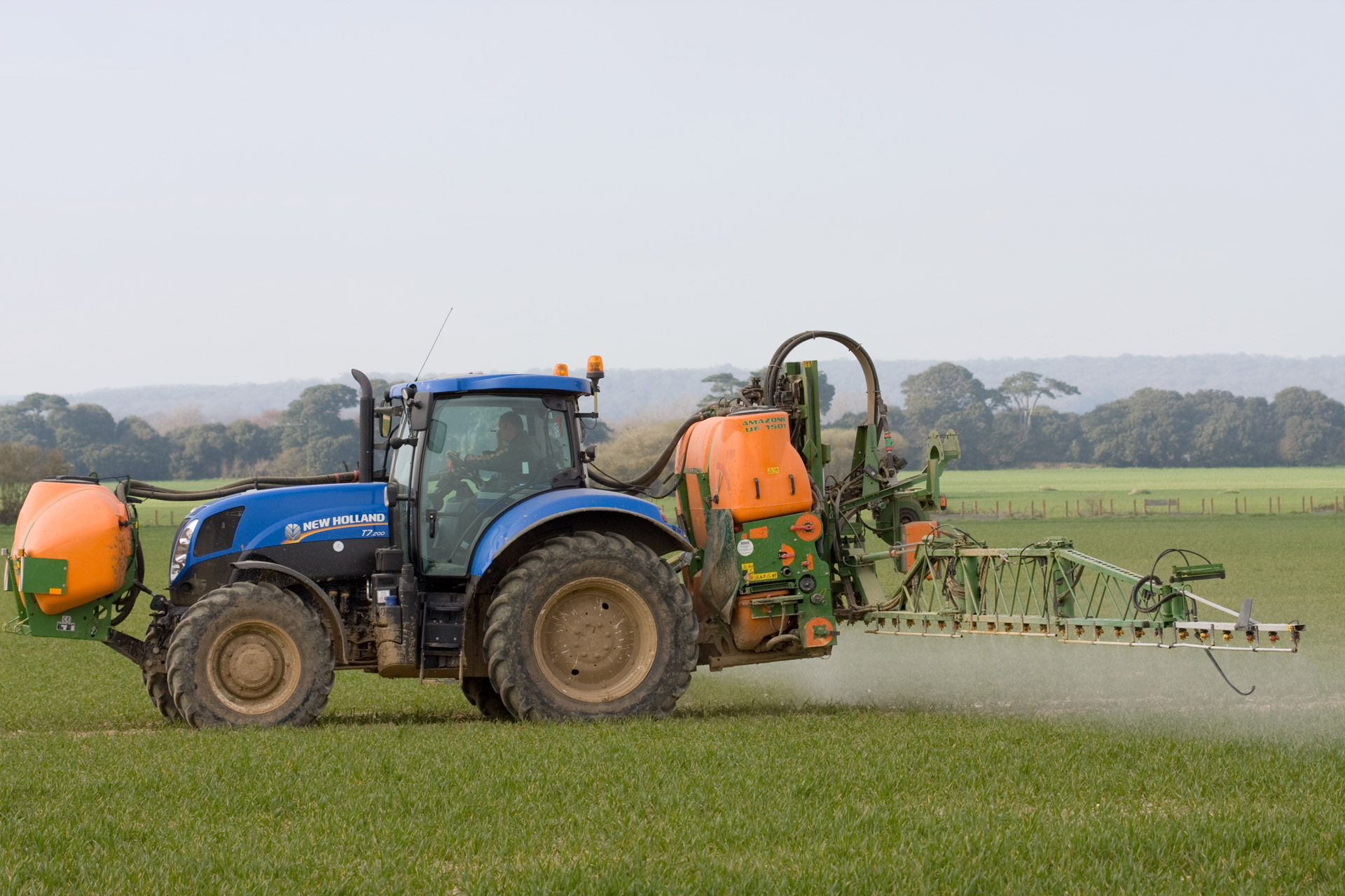 tractor spraying crop spraying free photo