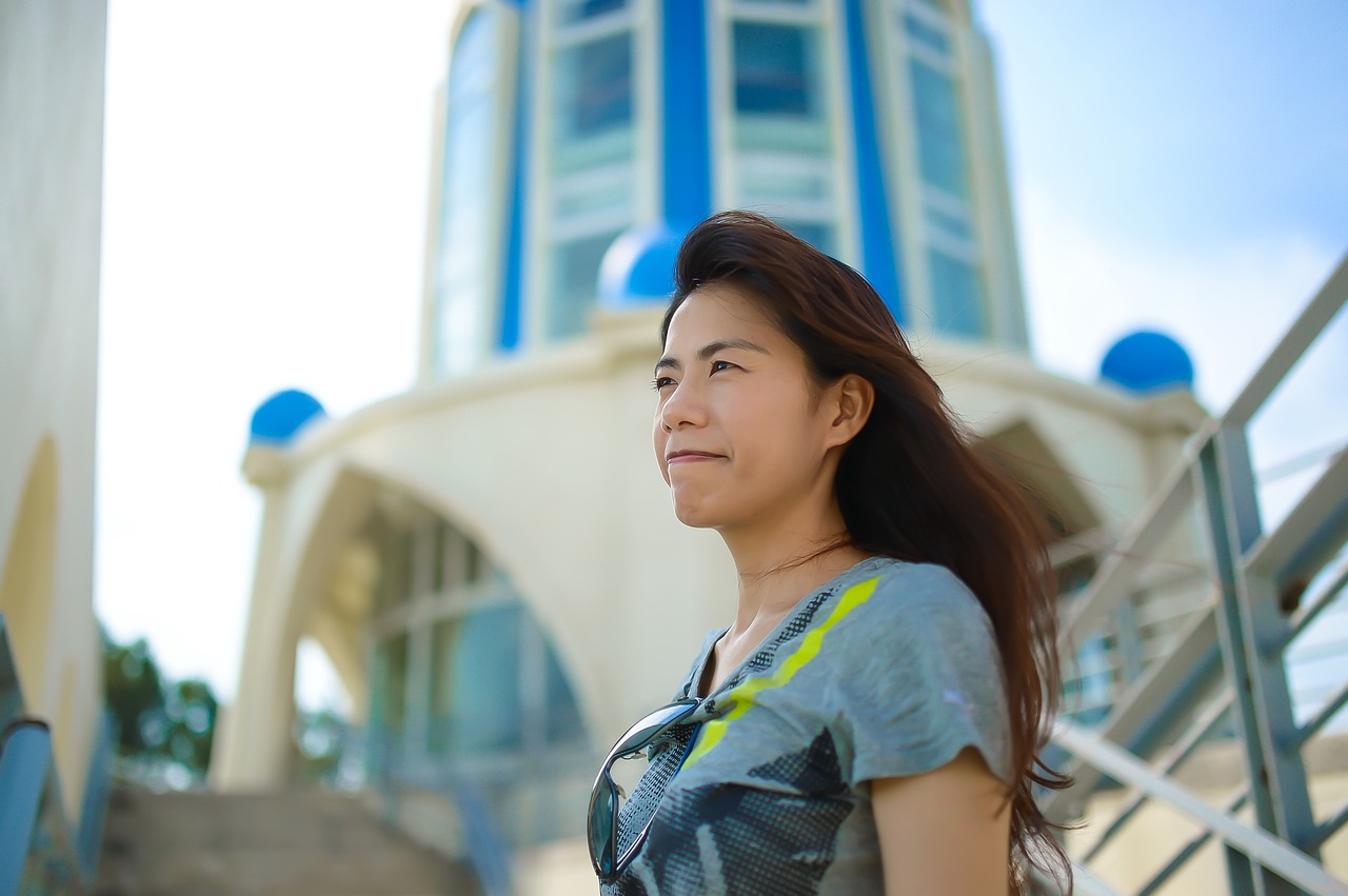 travel asian woman wind blowing free photo