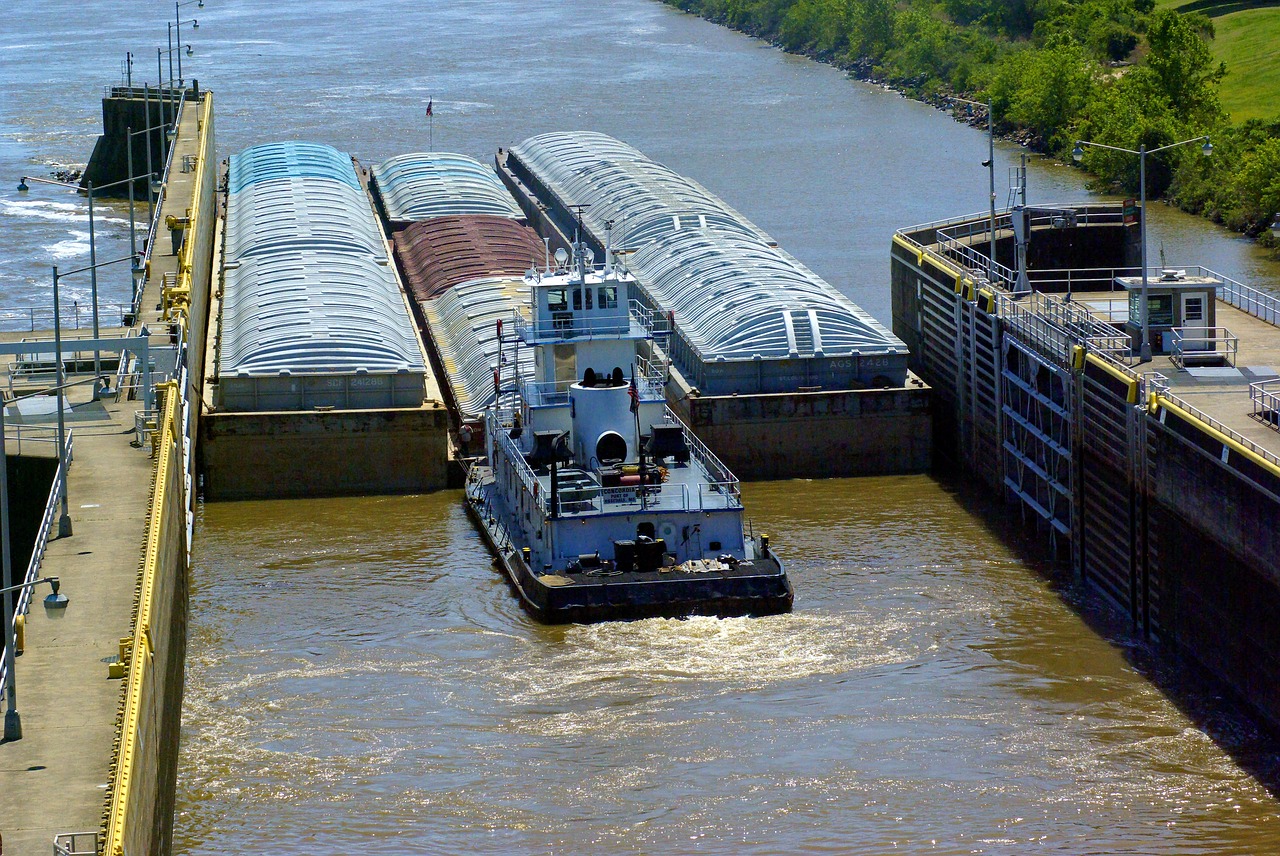 tug barges exiting murray lock  barges  lock free photo