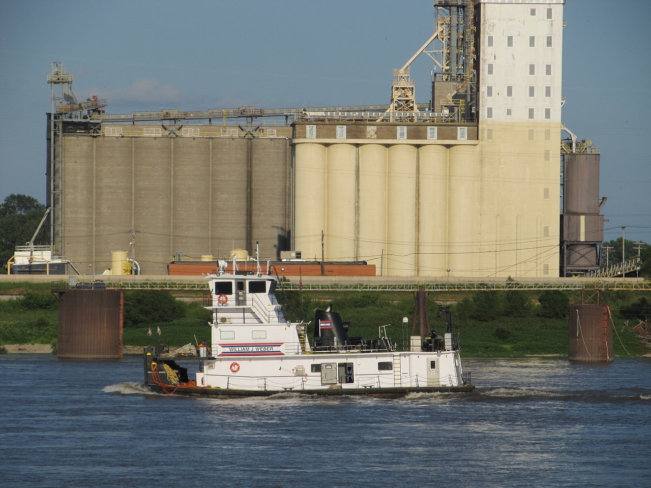 tugboat river grain elevator free photo