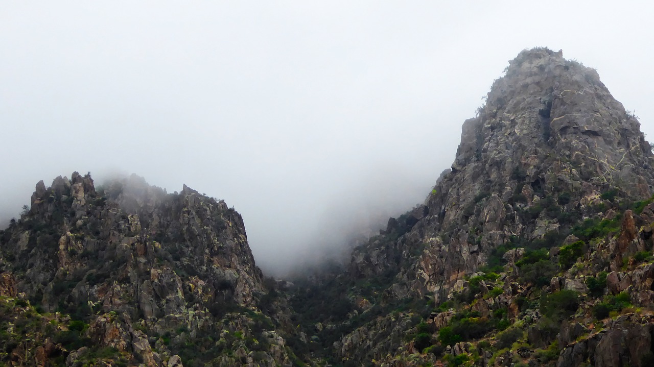 two mountains fog jagged free photo