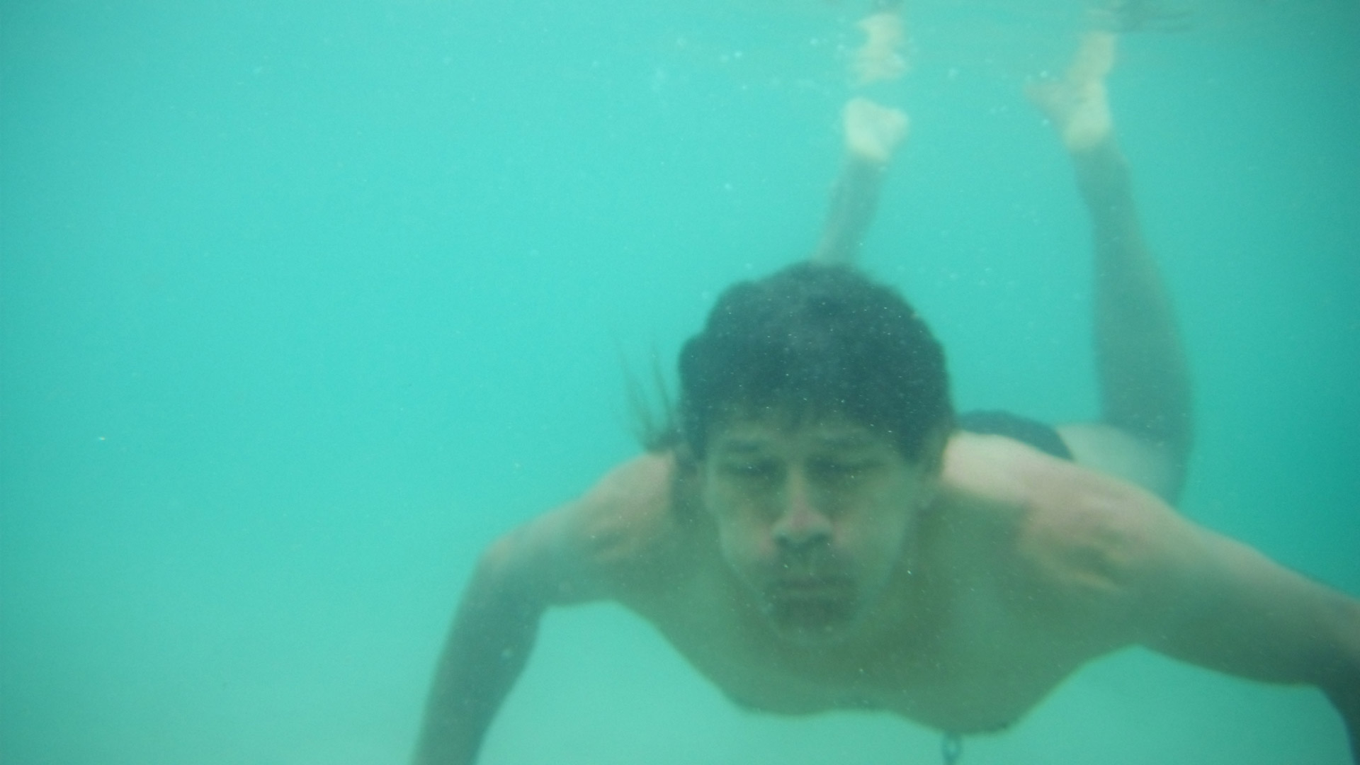 underwater swimming man free photo