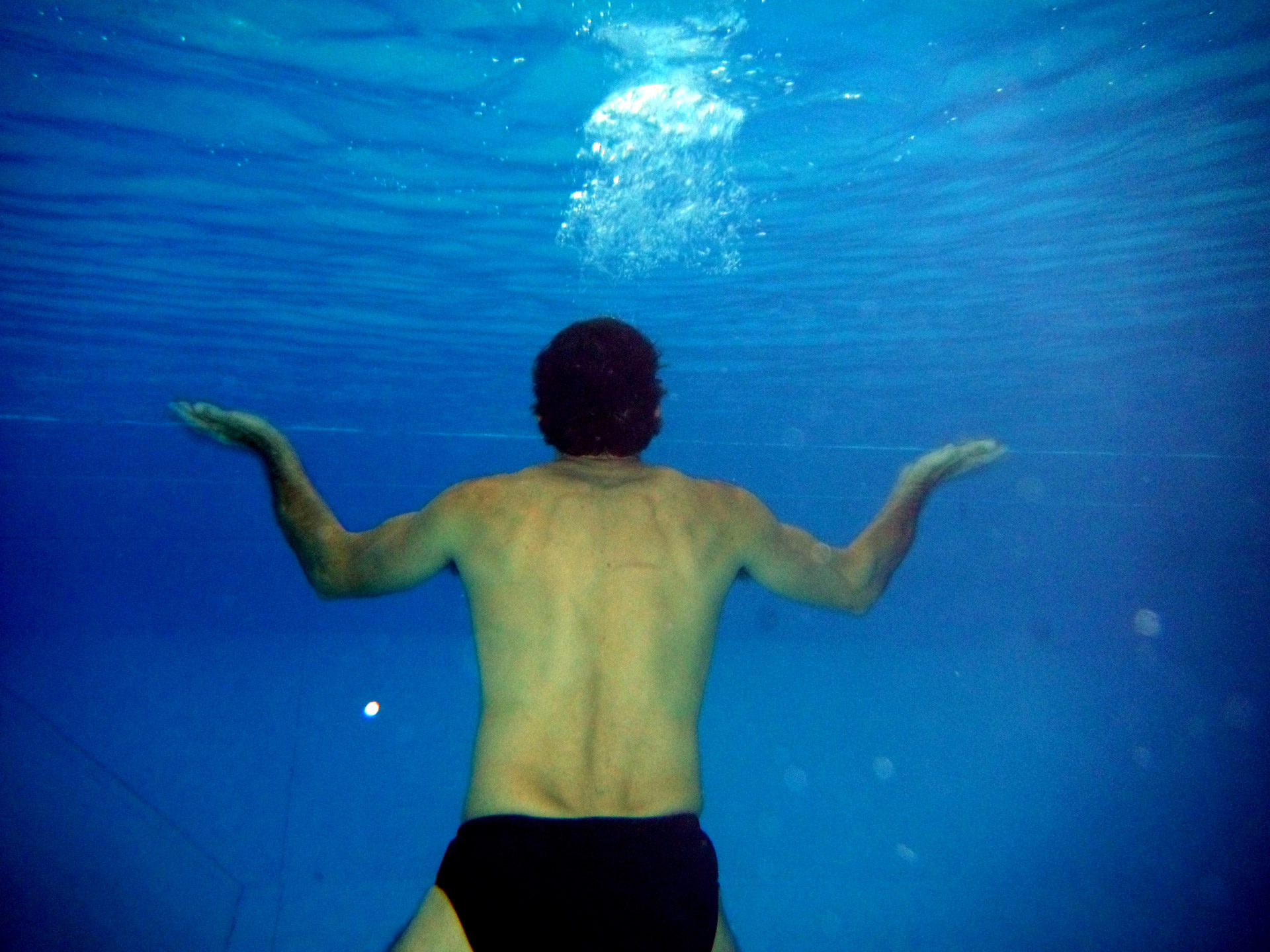 underwater swimming man free photo