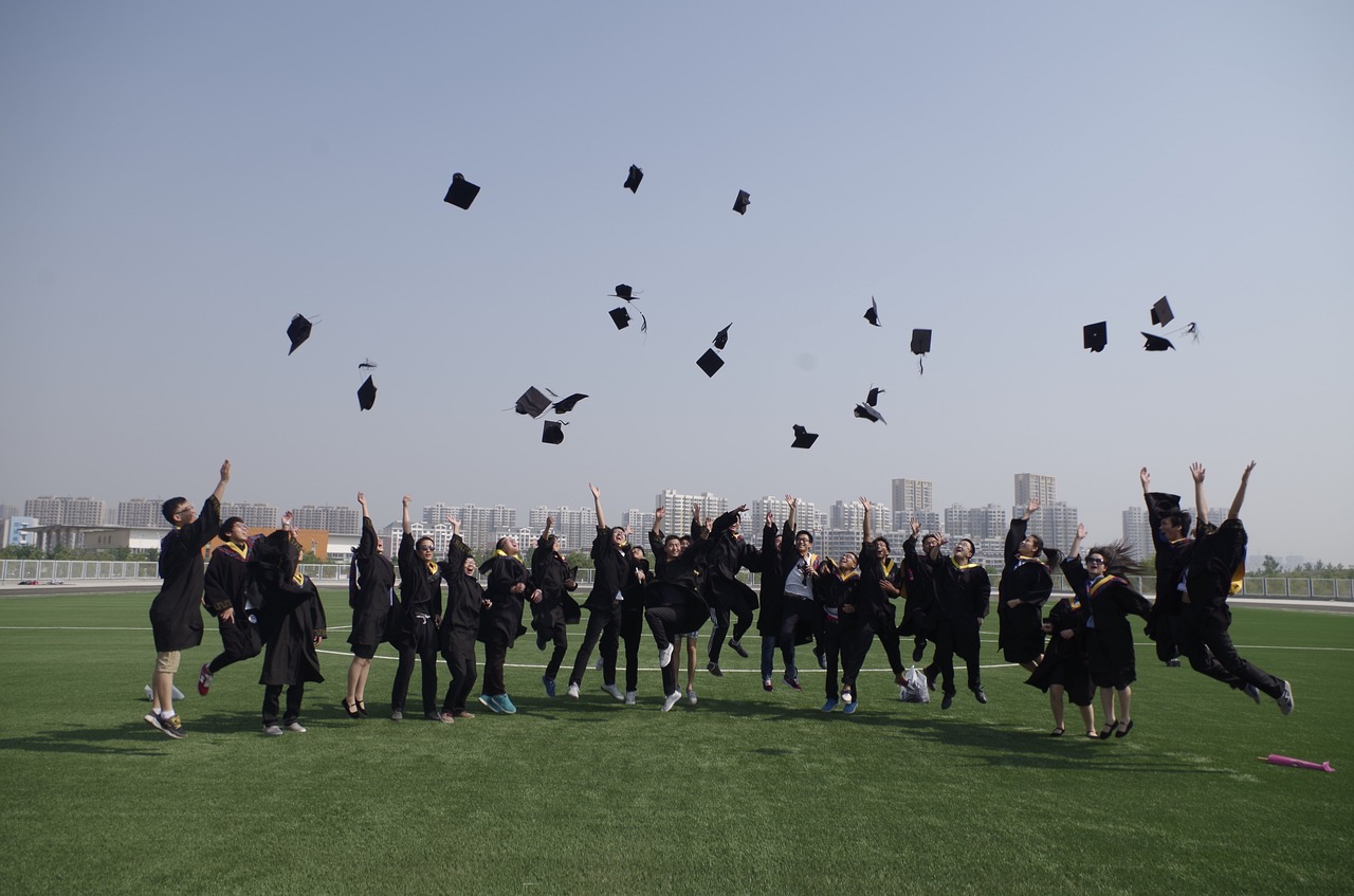 university student graduation jump free photo