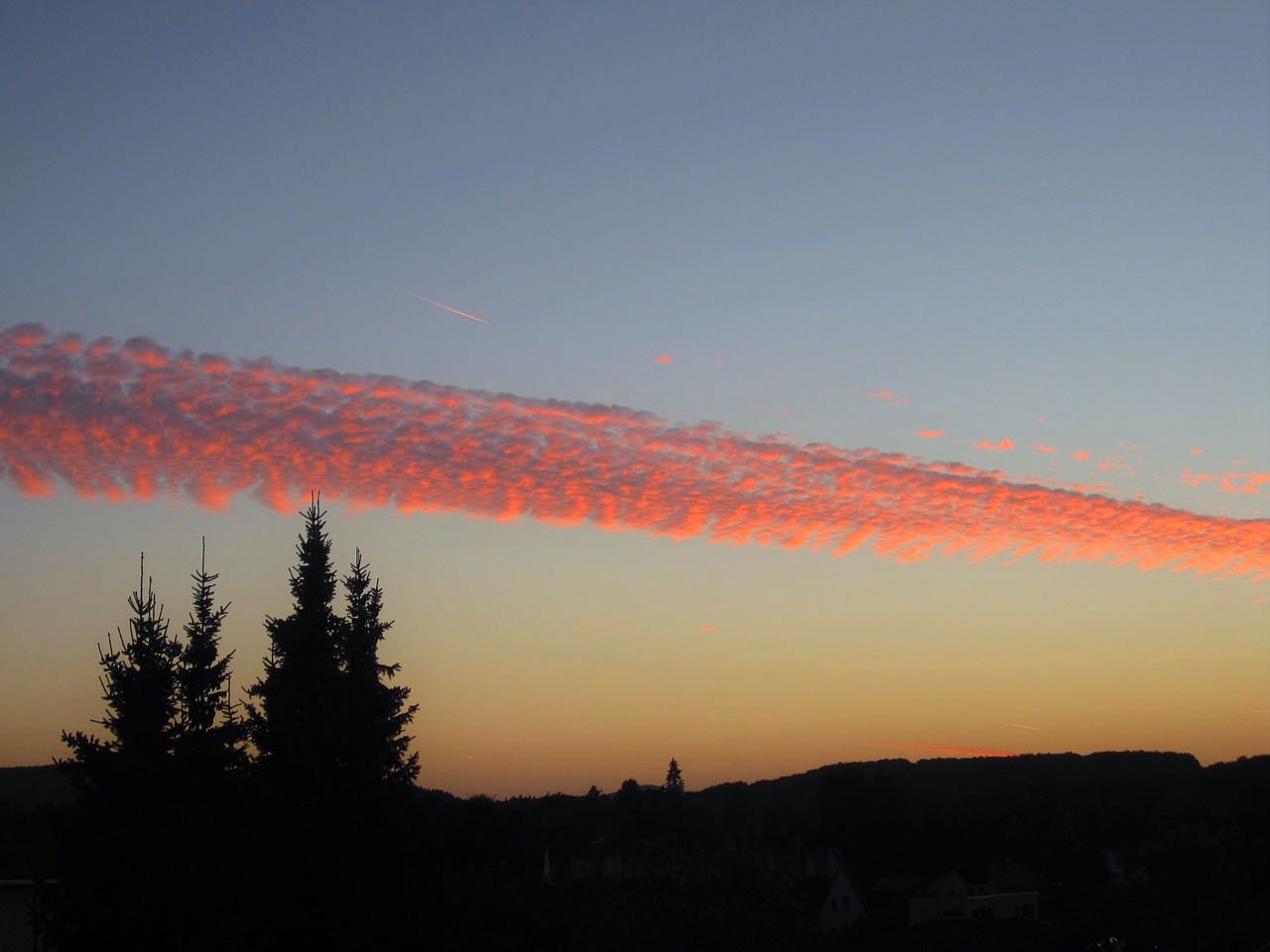 unusual sunset contrail free photo