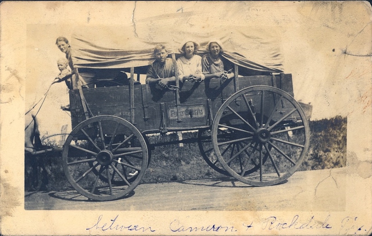 vintage covered wagon family free photo