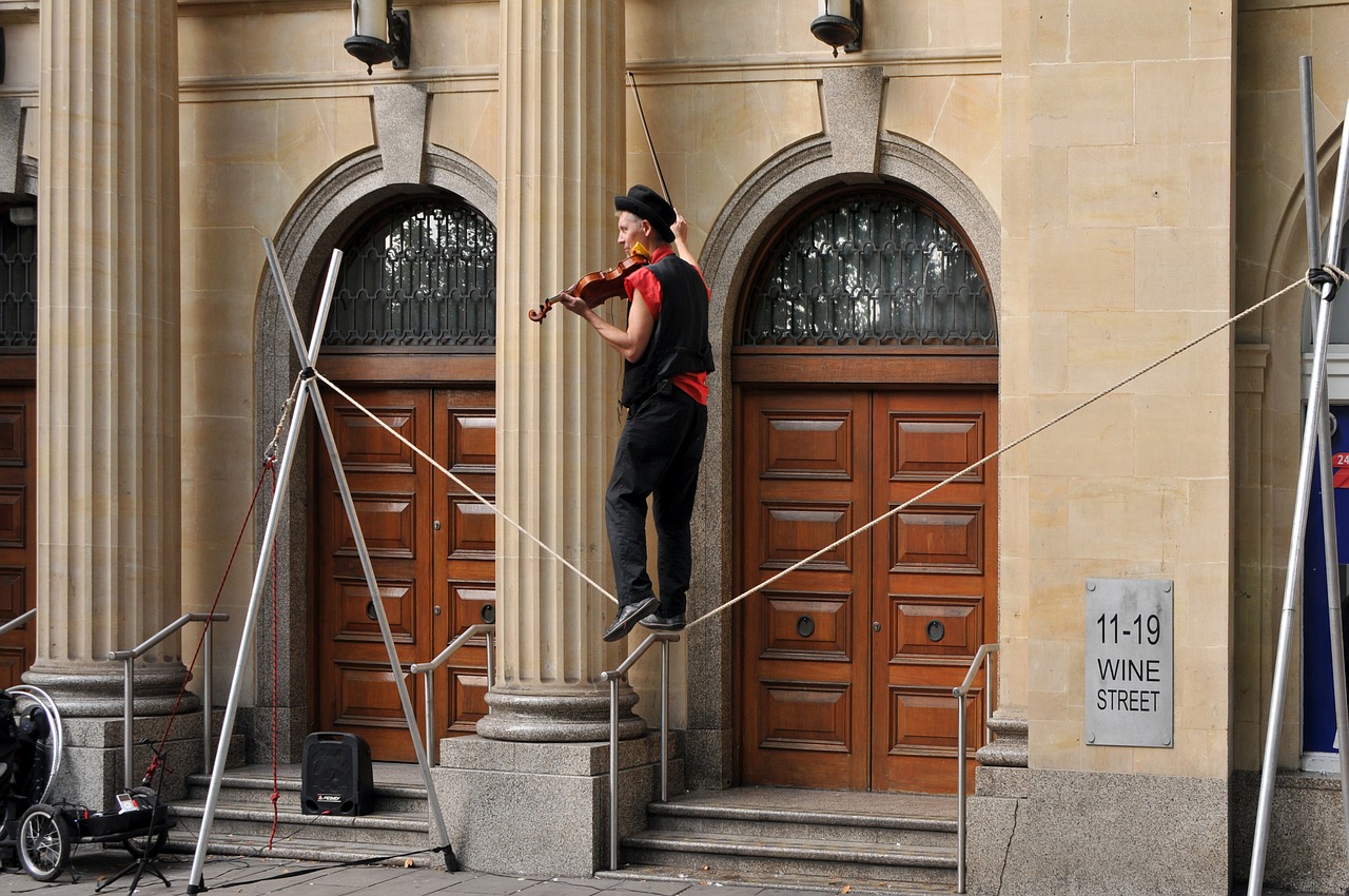 violinist tightrope walker clown free photo