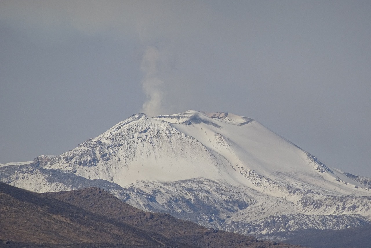 volcano smoking snow free photo