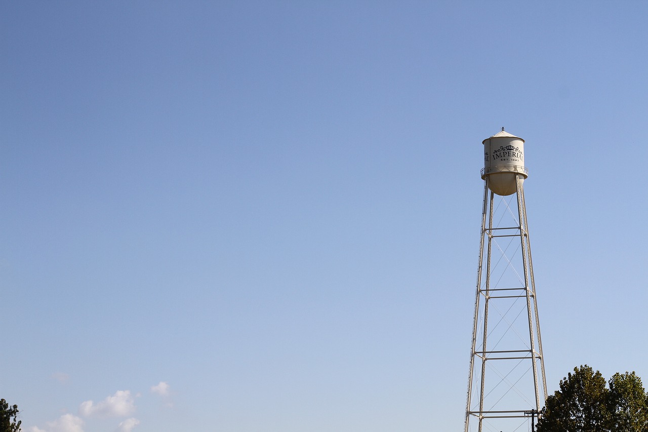 water tower  small texas city  next to sugar factory free photo