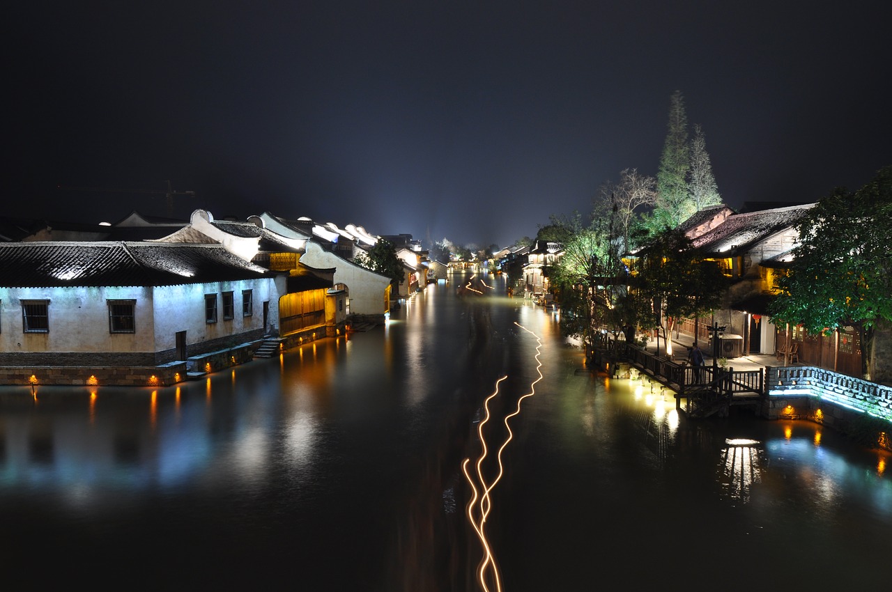watercourse small town night view free photo