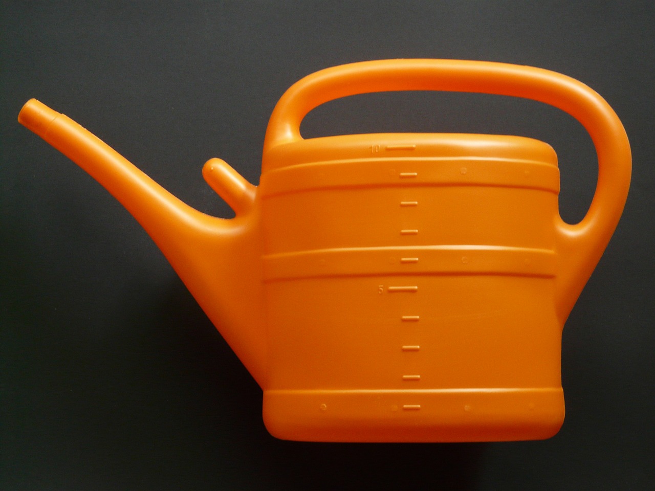 watering can casting orange free photo