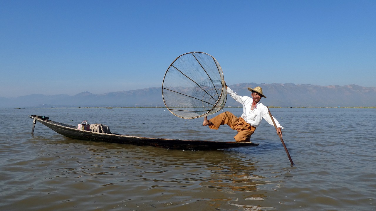 waters  fisherman  sky free photo