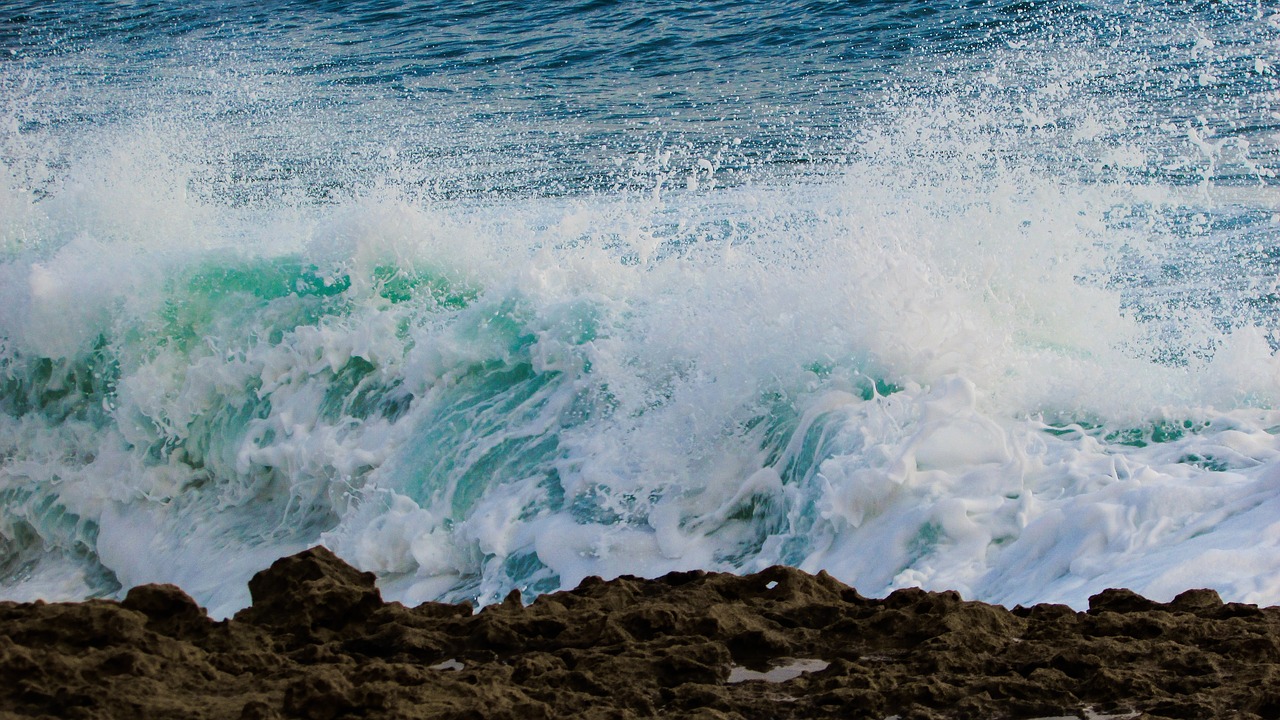 wave smashing rocky coast free photo