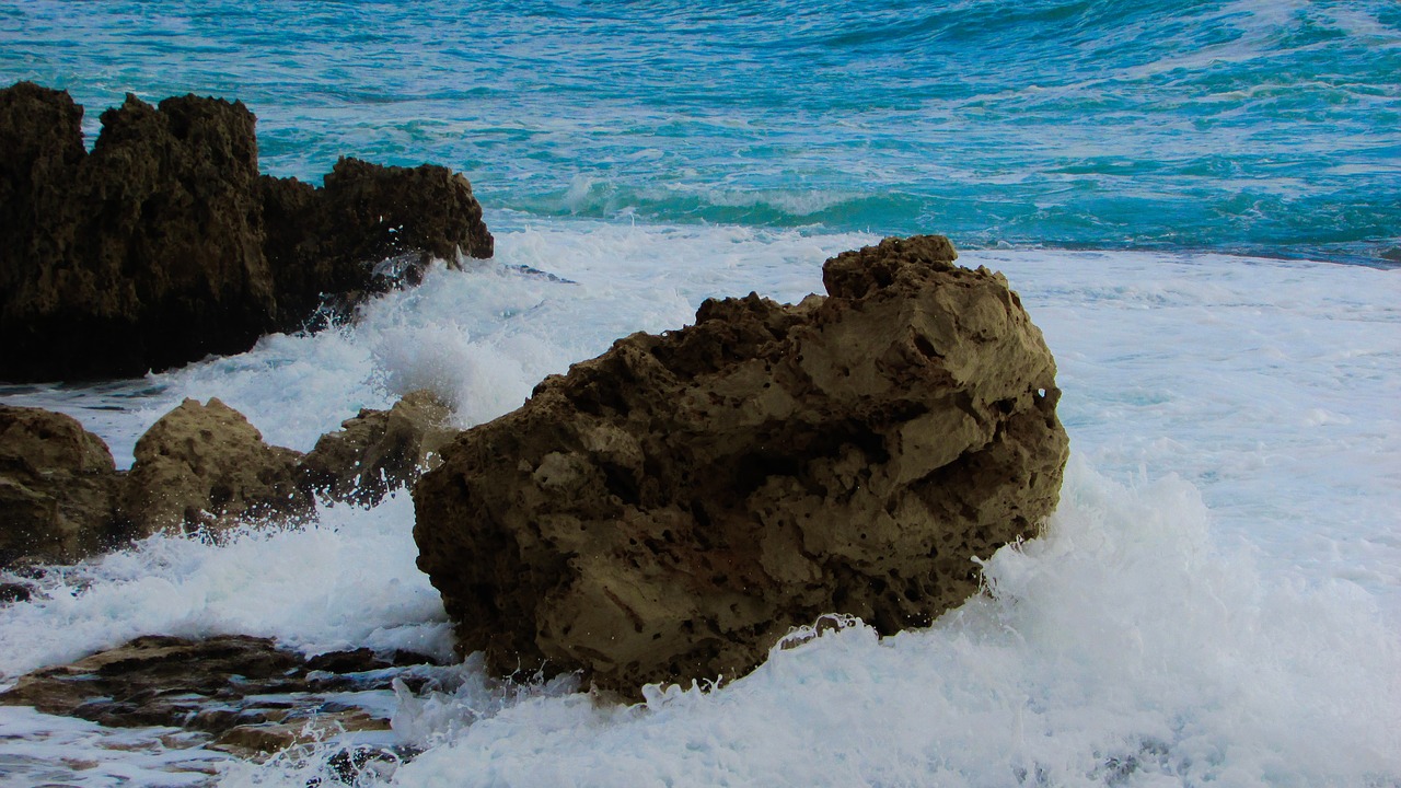 wave smashing rocky coast free photo