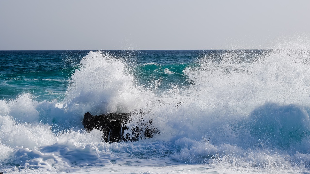 wave smashing rock free photo