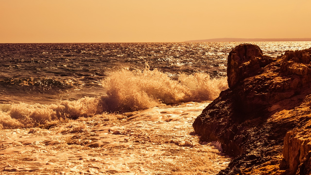 wave smashing rocky coast free photo