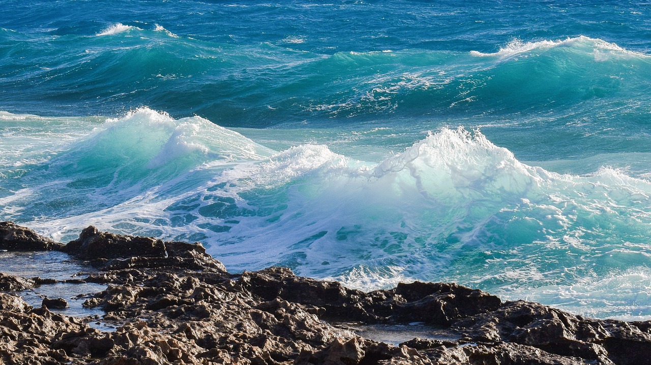 wave crushing rocky coast free photo