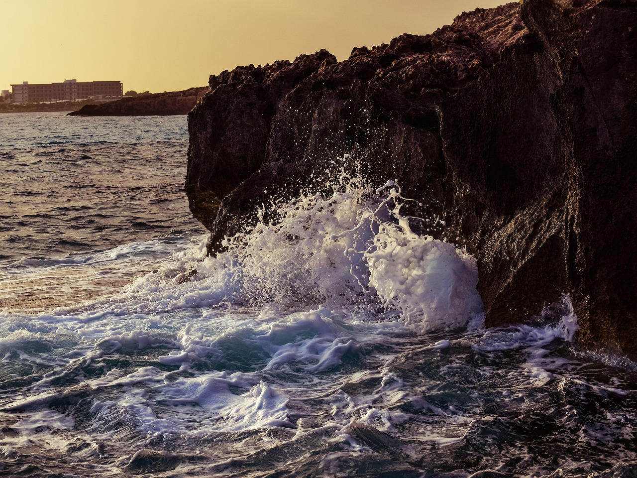 wave crushing rocky coast free photo