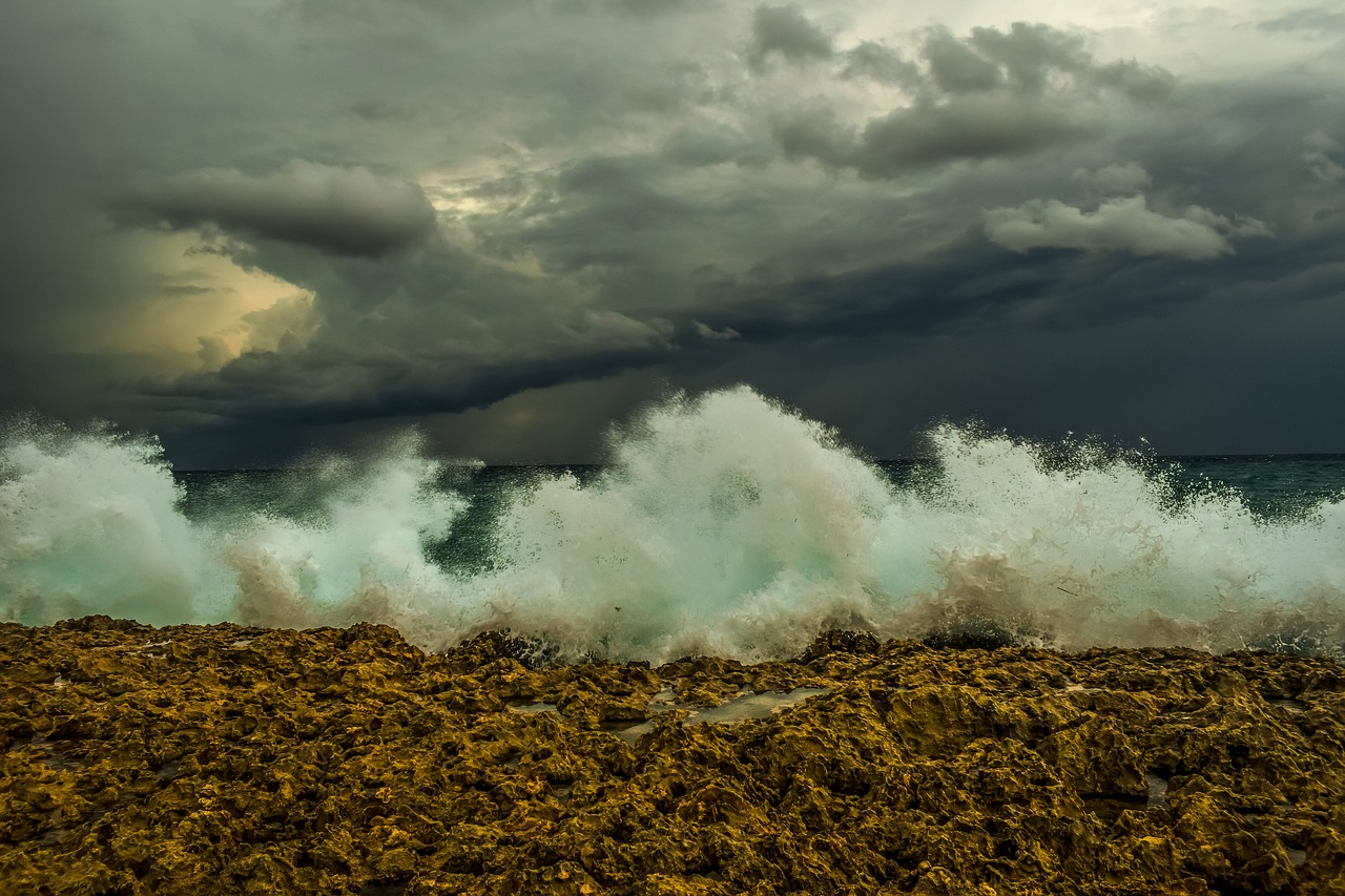 wave  crashing  rocky coast free photo