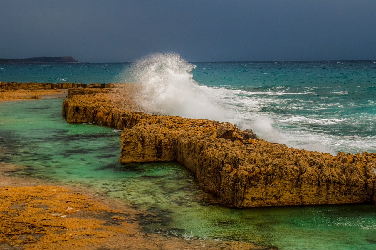 wave  crashing  rocky coast free photo