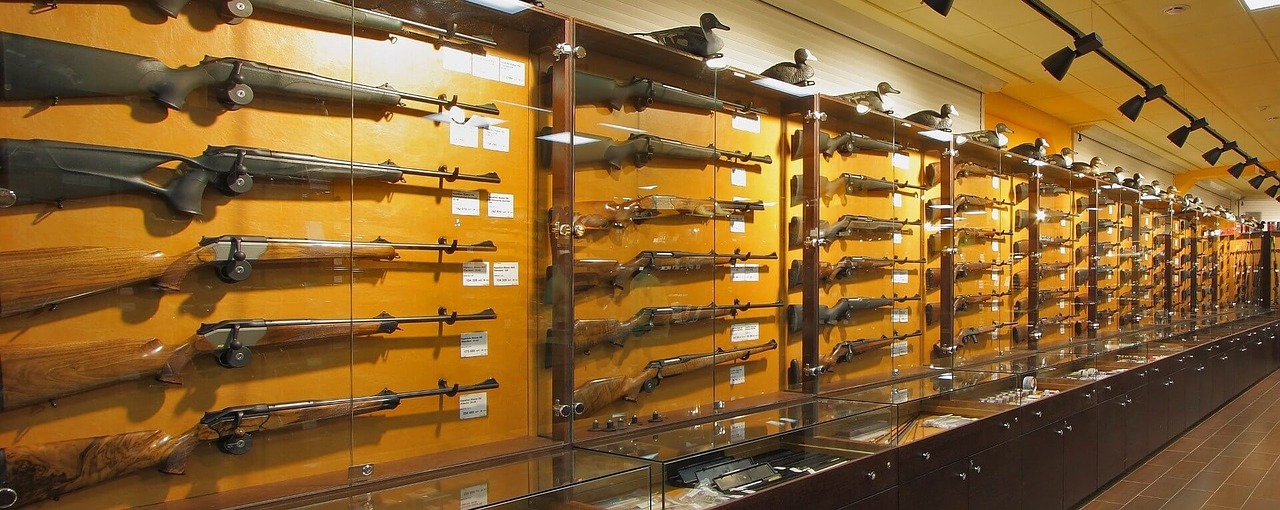 weapons stand with arms weapon shop free photo