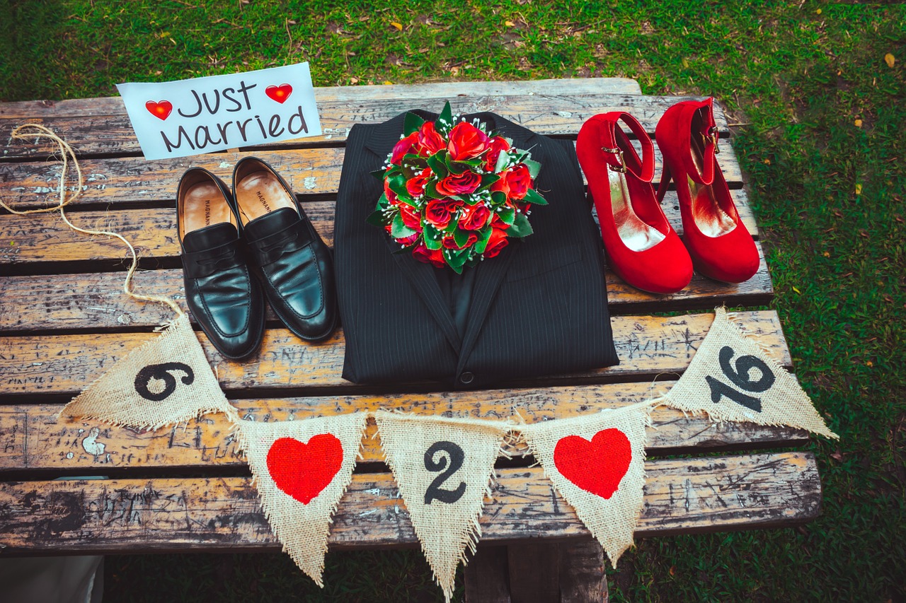 wedding grooms embracing each other free photo