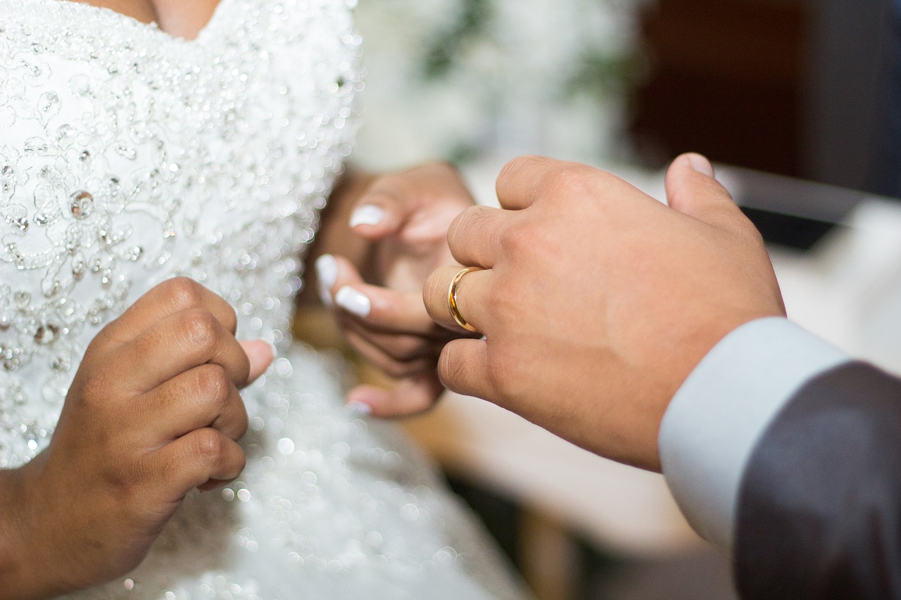 wedding  rings  hands free photo