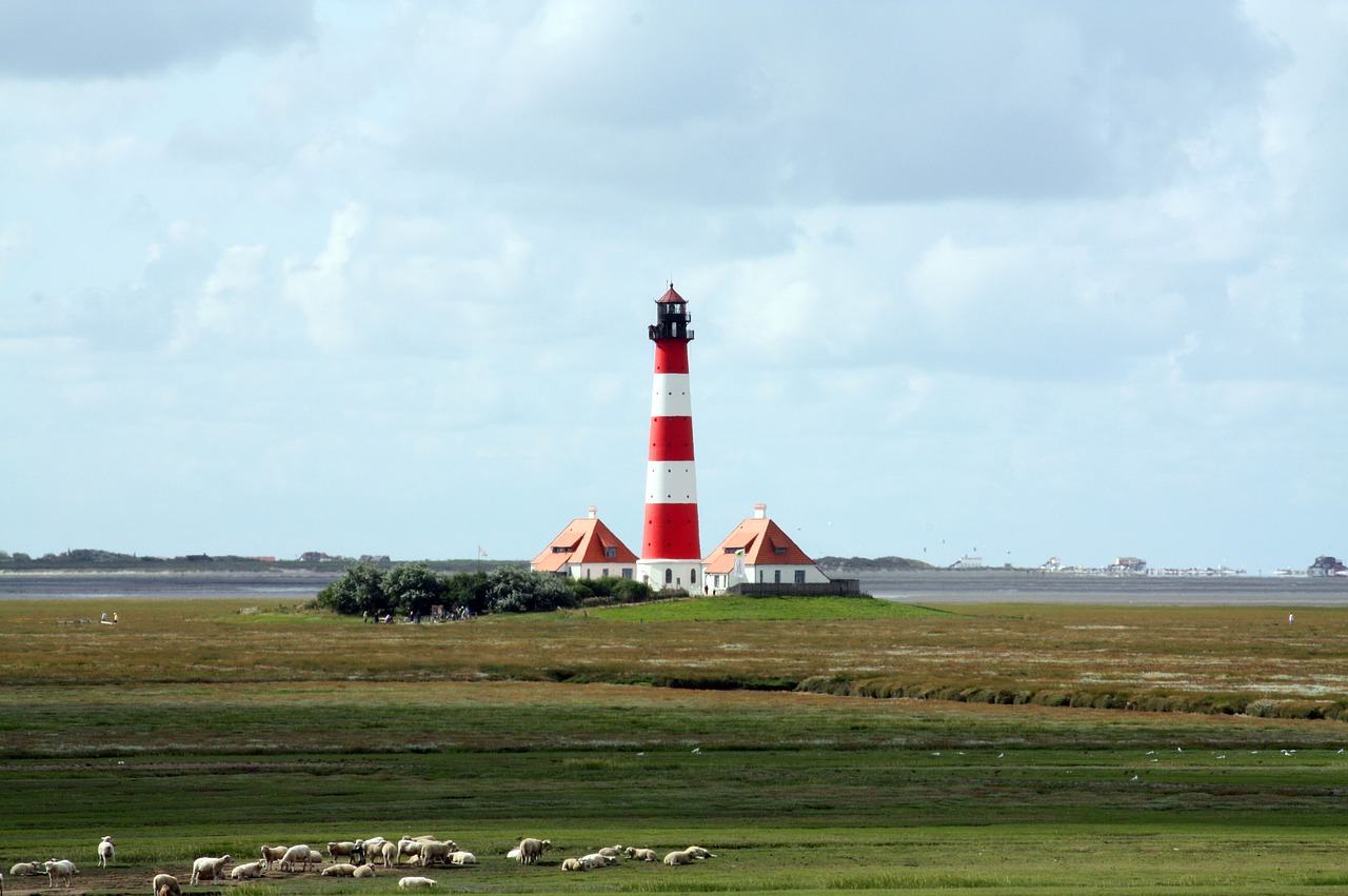 westerhever lighthouse  salt marshes  national park wadden sea free photo