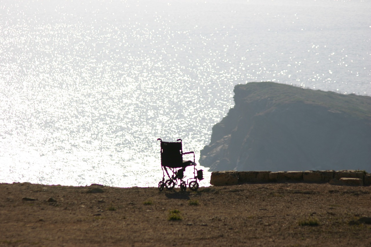 wheelchair sun sea free photo