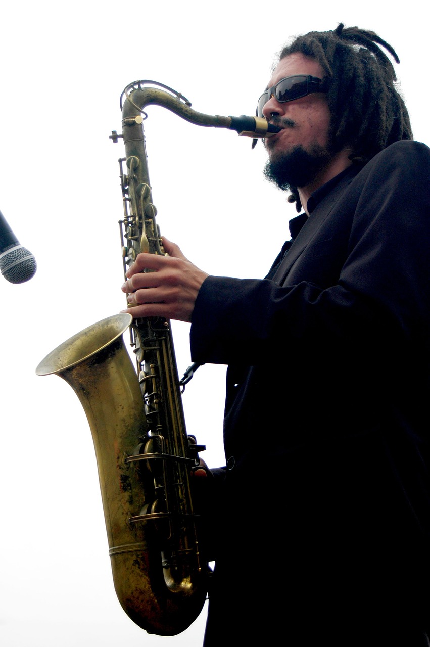 white background sax musician free photo