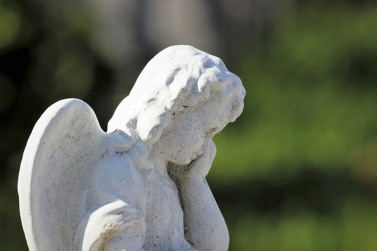 white stone angel  crying  statue free photo