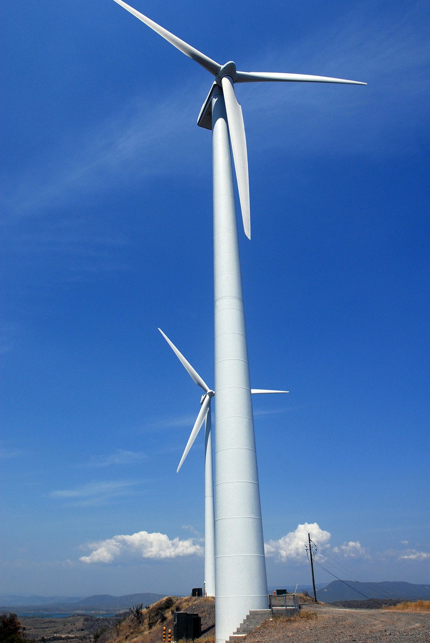 wind turbines sky clouds free photo