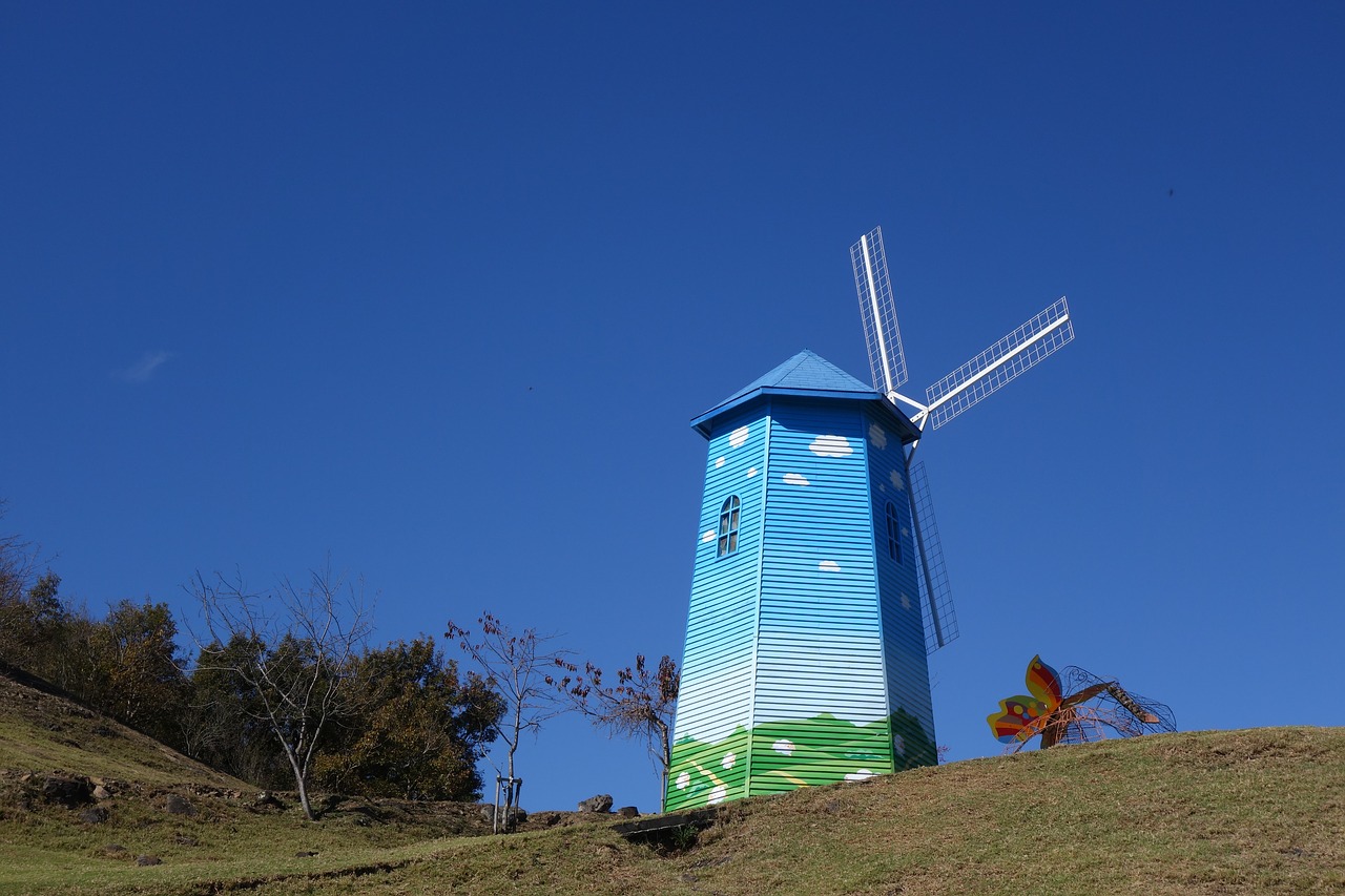 windmill farm blue sky free photo