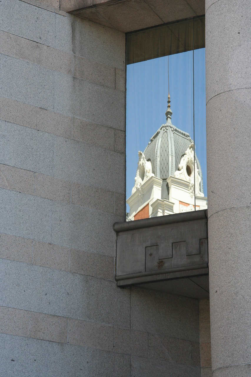 window mirroring building free photo