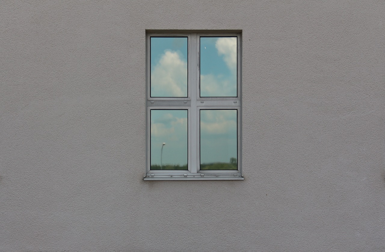 window mirroring sky free photo