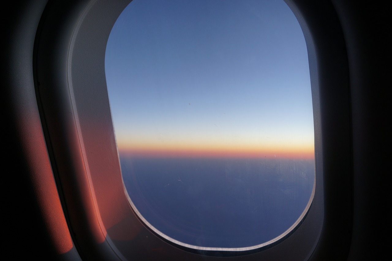 window seat sunrise in the skies daybreak free photo