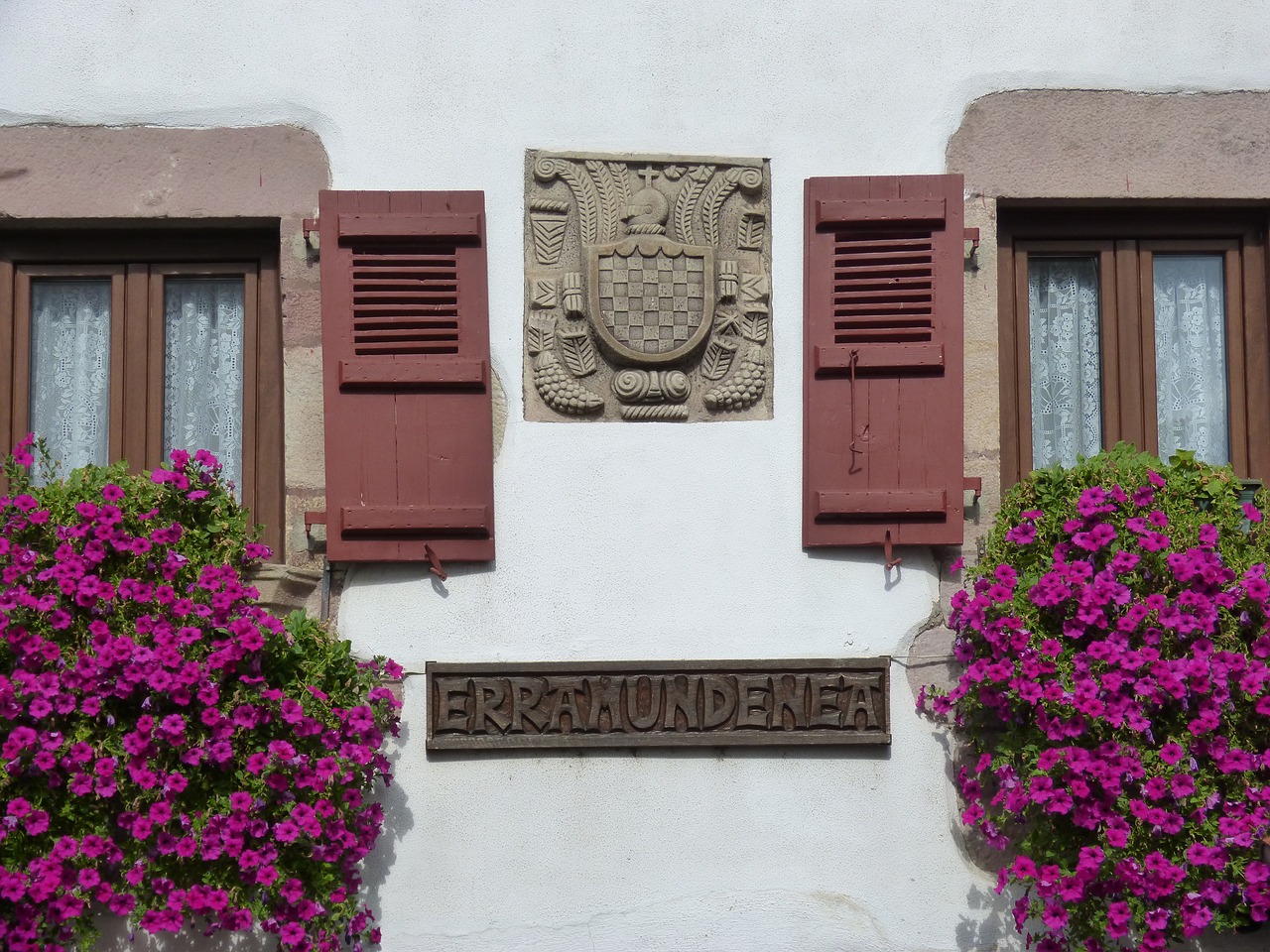 windows  coat of arms  flowers free photo